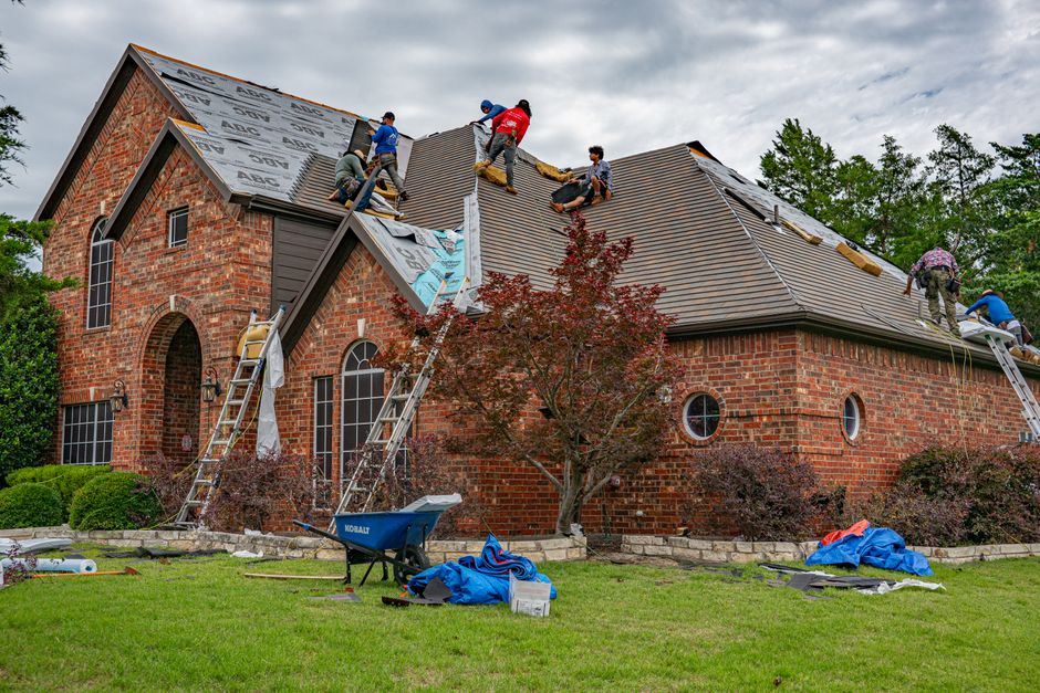 Finished asphalt shingle roof with aligned rows and proper coverage on residential house