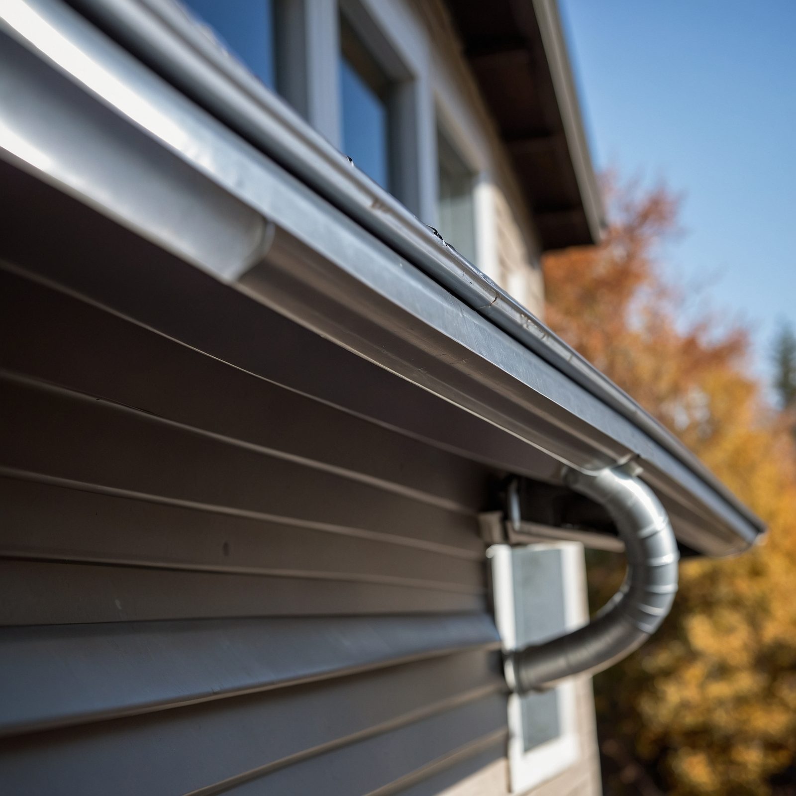 Metal gutter system on residential home exterior